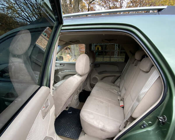 Зеленый Киа Sportage, объемом двигателя 2 л и пробегом 300 тыс. км за 3750 $, фото 20 на Automoto.ua