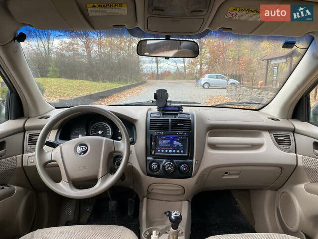 Зеленый Киа Sportage, объемом двигателя 2 л и пробегом 300 тыс. км за 3750 $, фото 24 на Automoto.ua