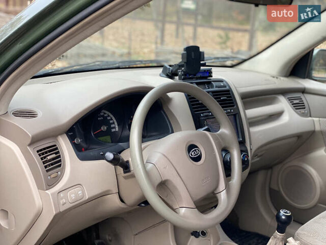Зеленый Киа Sportage, объемом двигателя 2 л и пробегом 300 тыс. км за 3750 $, фото 22 на Automoto.ua