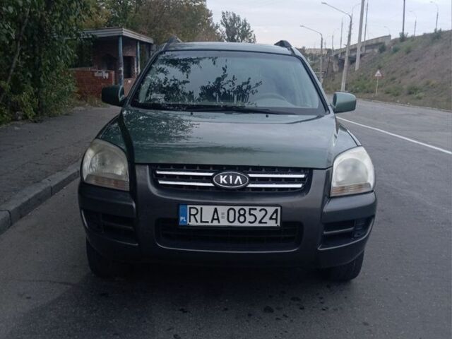 Зеленый Киа Sportage, объемом двигателя 2 л и пробегом 300 тыс. км за 4117 $, фото 1 на Automoto.ua