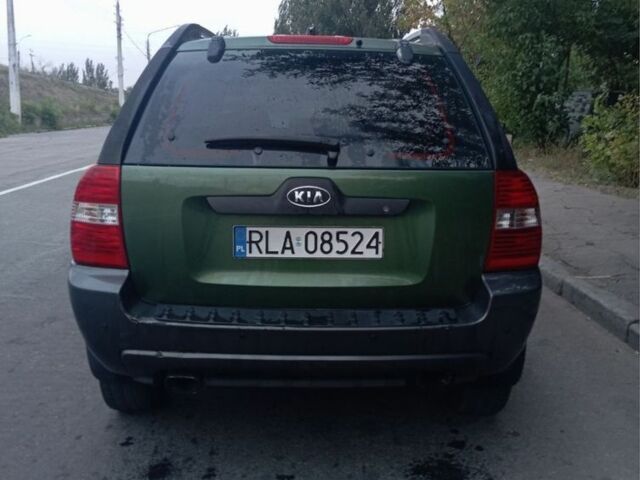 Зеленый Киа Sportage, объемом двигателя 2 л и пробегом 300 тыс. км за 4117 $, фото 2 на Automoto.ua