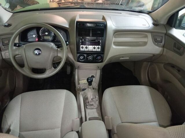 Зеленый Киа Sportage, объемом двигателя 2 л и пробегом 300 тыс. км за 4117 $, фото 5 на Automoto.ua