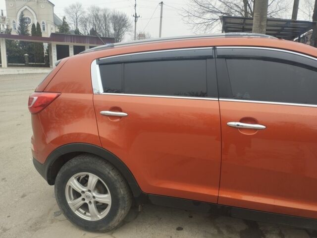 Помаранчевий Кіа Sportage, об'ємом двигуна 2 л та пробігом 240 тис. км за 12600 $, фото 2 на Automoto.ua
