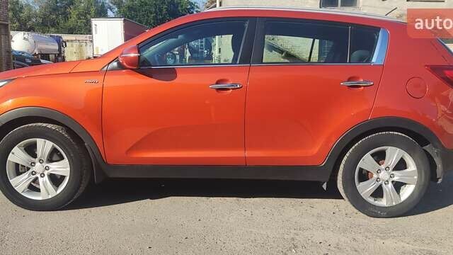 Оранжевый Киа Sportage, объемом двигателя 2 л и пробегом 120 тыс. км за 12599 $, фото 2 на Automoto.ua