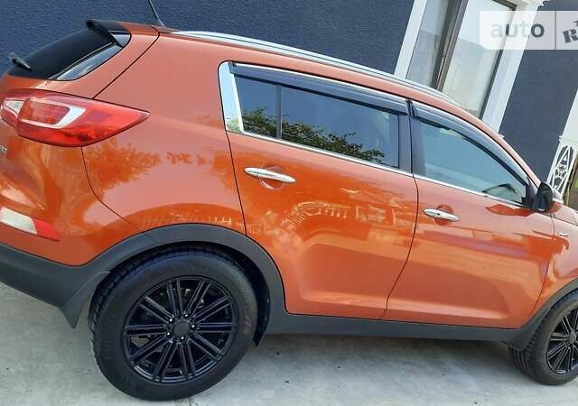 Помаранчевий Кіа Sportage, об'ємом двигуна 2 л та пробігом 128 тис. км за 15700 $, фото 1 на Automoto.ua