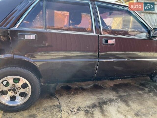 Коричневый Лянча Дельта, объемом двигателя 1.3 л и пробегом 290 тыс. км за 600 $, фото 6 на Automoto.ua