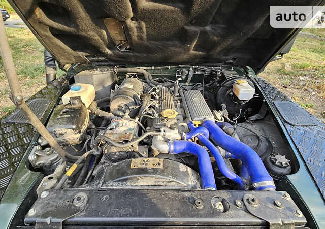 Чорний Ленд Ровер Дефендер, об'ємом двигуна 2.5 л та пробігом 231 тис. км за 56000 $, фото 16 на Automoto.ua