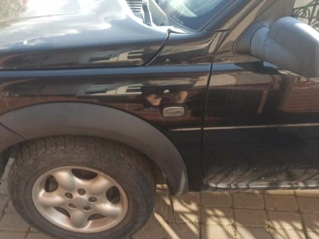 Чорний Ленд Ровер Freelander, об'ємом двигуна 1.8 л та пробігом 164 тис. км за 5000 $, фото 2 на Automoto.ua