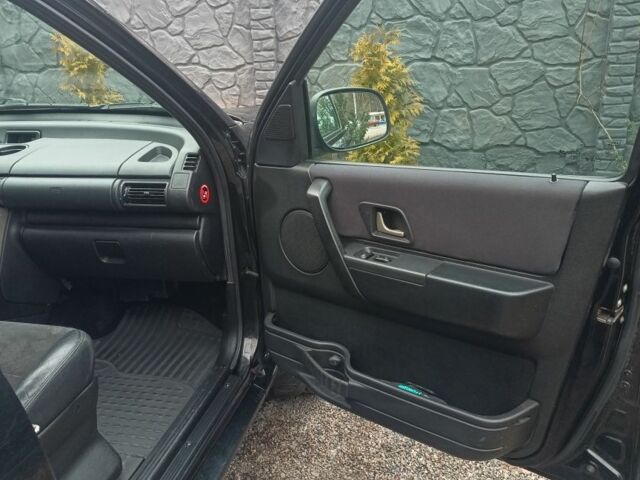 Черный Ленд Ровер Фрилендер, объемом двигателя 2 л и пробегом 259 тыс. км за 5777 $, фото 12 на Automoto.ua