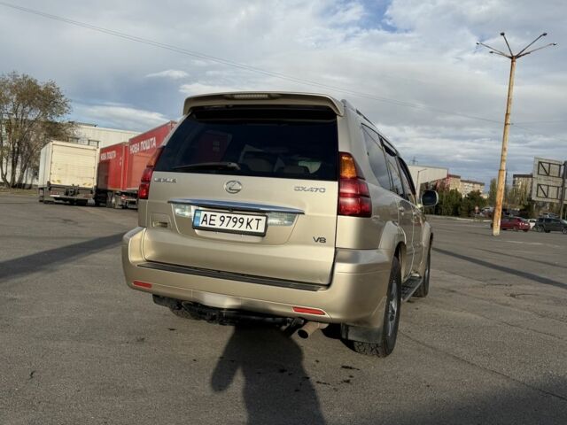 Бежевый Лексус ГХ, объемом двигателя 4.7 л и пробегом 247 тыс. км за 13950 $, фото 3 на Automoto.ua