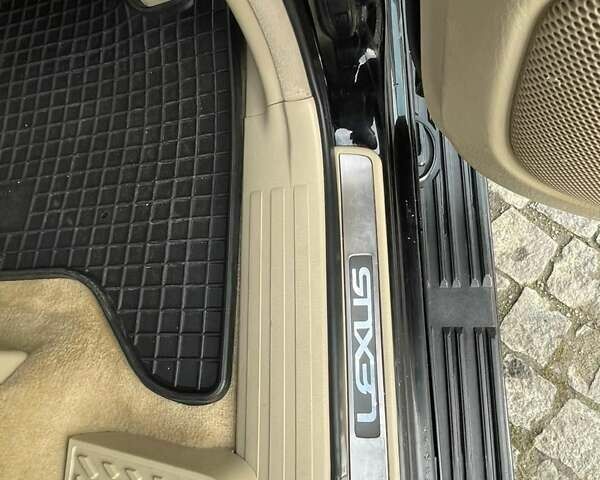 Черный Лексус ГХ, объемом двигателя 4.66 л и пробегом 235 тыс. км за 14600 $, фото 7 на Automoto.ua