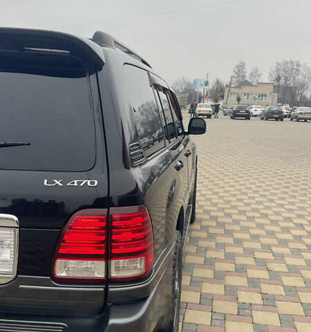 Чорний Лексус ЛХ, об'ємом двигуна 4.66 л та пробігом 305 тис. км за 17000 $, фото 4 на Automoto.ua