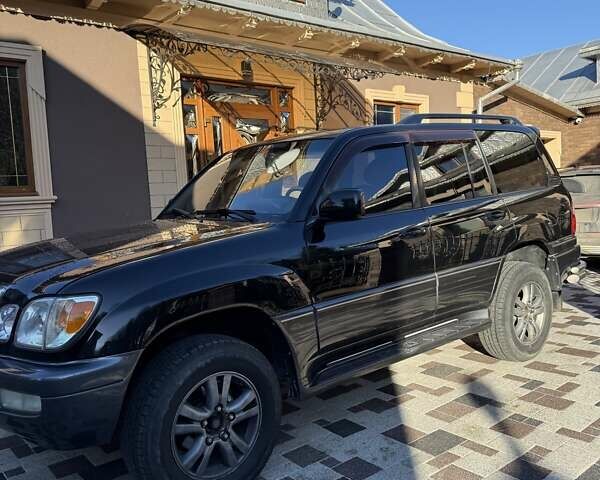 Черный Лексус ЛХ, объемом двигателя 4.66 л и пробегом 292 тыс. км за 12800 $, фото 2 на Automoto.ua