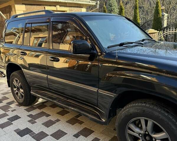 Черный Лексус ЛХ, объемом двигателя 4.66 л и пробегом 292 тыс. км за 12800 $, фото 3 на Automoto.ua