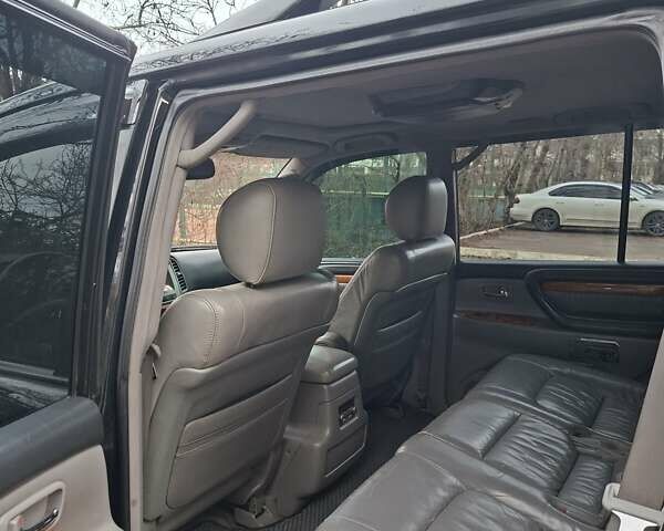 Черный Лексус ЛХ, объемом двигателя 4.66 л и пробегом 300 тыс. км за 12000 $, фото 6 на Automoto.ua