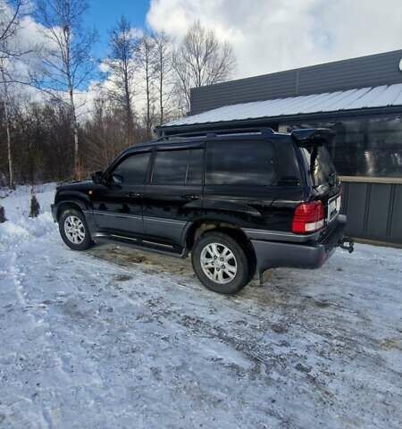 Черный Лексус ЛХ, объемом двигателя 4.7 л и пробегом 297 тыс. км за 14800 $, фото 1 на Automoto.ua