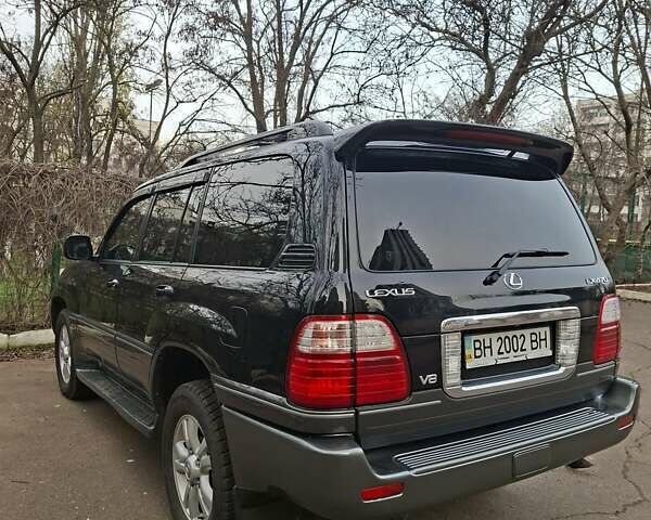 Черный Лексус ЛХ, объемом двигателя 4.66 л и пробегом 300 тыс. км за 12000 $, фото 4 на Automoto.ua