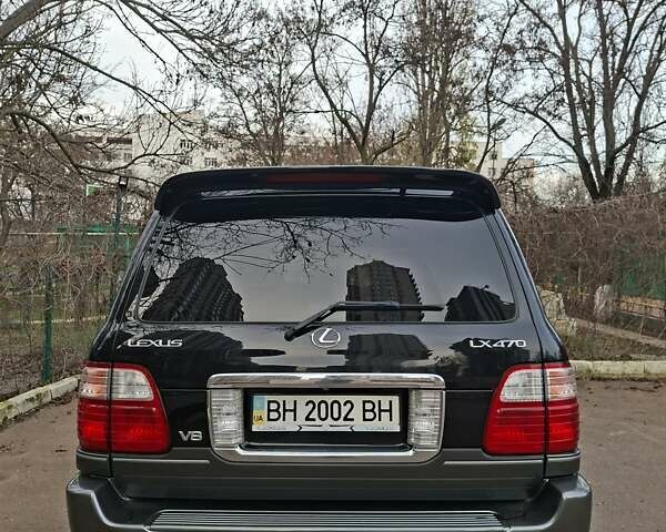 Черный Лексус ЛХ, объемом двигателя 4.66 л и пробегом 300 тыс. км за 12000 $, фото 3 на Automoto.ua