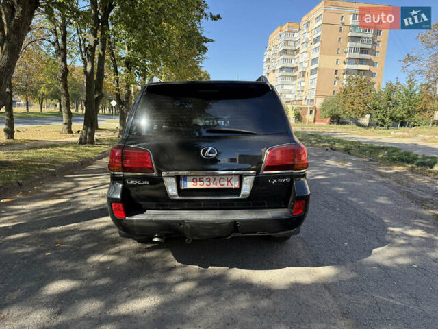 Черный Лексус ЛХ, объемом двигателя 5.66 л и пробегом 278 тыс. км за 23500 $, фото 1 на Automoto.ua