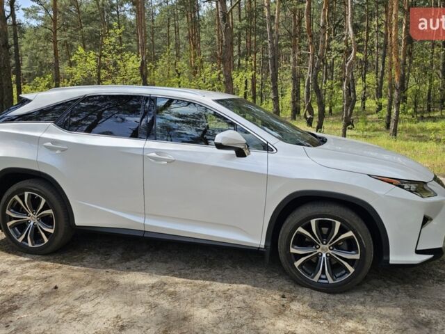 Білий Лексус РХ, об'ємом двигуна 2 л та пробігом 105 тис. км за 35400 $, фото 1 на Automoto.ua