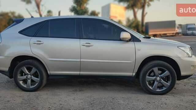 Бежевый Лексус РХ, объемом двигателя 3.31 л и пробегом 225 тыс. км за 10500 $, фото 1 на Automoto.ua
