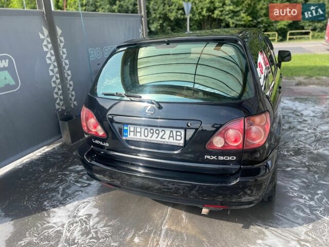 Черный Лексус РХ, объемом двигателя 3 л и пробегом 310 тыс. км за 5400 $, фото 1 на Automoto.ua