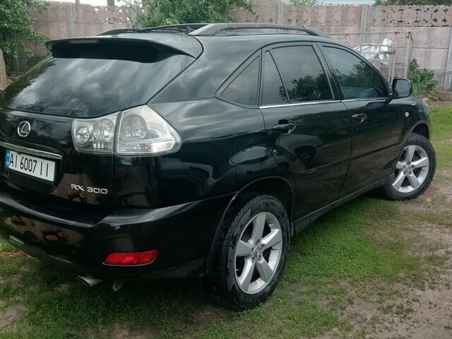 Чорний Лексус РХ, об'ємом двигуна 3 л та пробігом 246 тис. км за 8000 $, фото 1 на Automoto.ua