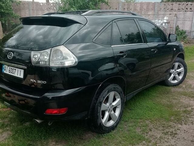 Чорний Лексус РХ, об'ємом двигуна 3 л та пробігом 246 тис. км за 9500 $, фото 1 на Automoto.ua