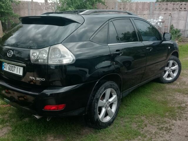 Чорний Лексус РХ, об'ємом двигуна 3 л та пробігом 246 тис. км за 7773 $, фото 2 на Automoto.ua