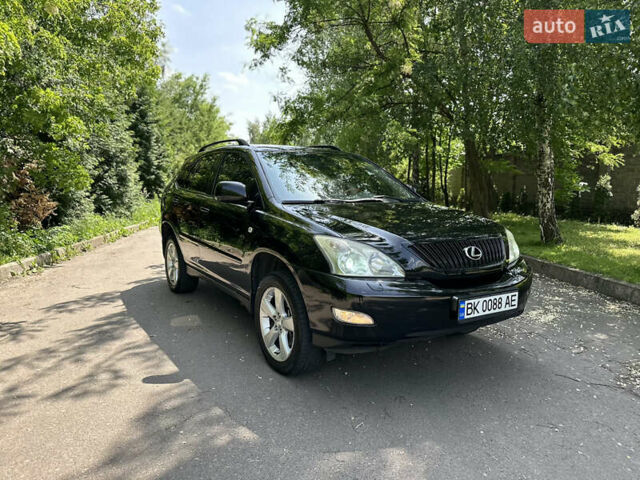 Черный Лексус РХ, объемом двигателя 3.46 л и пробегом 247 тыс. км за 11499 $, фото 1 на Automoto.ua