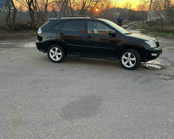 Черный Лексус РХ, объемом двигателя 3.5 л и пробегом 260 тыс. км за 13999 $, фото 1 на Automoto.ua