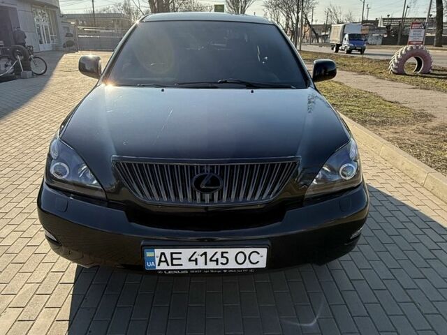 Черный Лексус РХ, объемом двигателя 3.5 л и пробегом 295 тыс. км за 11500 $, фото 1 на Automoto.ua