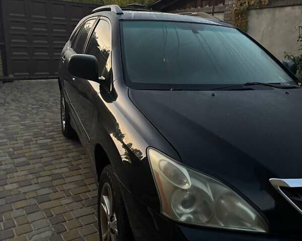 Черный Лексус РХ, объемом двигателя 3.3 л и пробегом 220 тыс. км за 10000 $, фото 1 на Automoto.ua