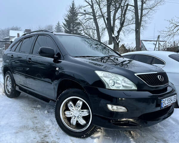 Черный Лексус РХ, объемом двигателя 3.5 л и пробегом 306 тыс. км за 11300 $, фото 1 на Automoto.ua