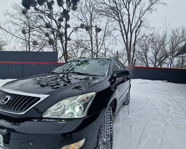 Черный Лексус РХ, объемом двигателя 3.46 л и пробегом 161 тыс. км за 11500 $, фото 1 на Automoto.ua