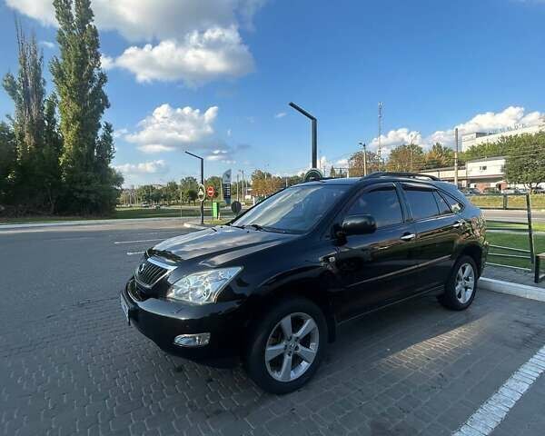 Черный Лексус РХ, объемом двигателя 3.46 л и пробегом 242 тыс. км за 14000 $, фото 1 на Automoto.ua