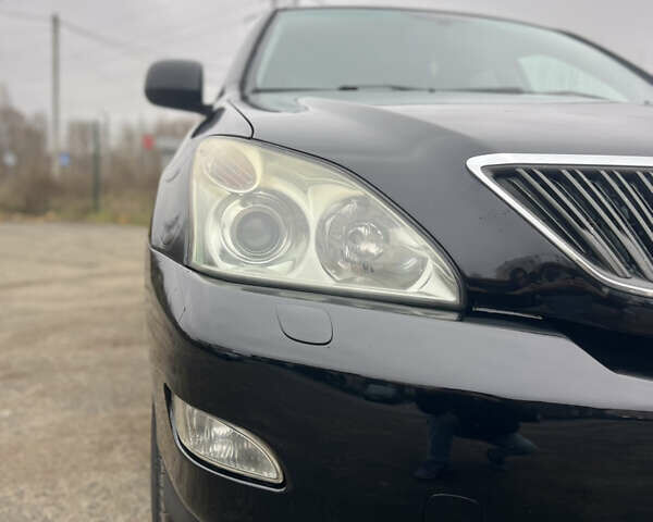 Черный Лексус РХ, объемом двигателя 3.46 л и пробегом 195 тыс. км за 12000 $, фото 2 на Automoto.ua