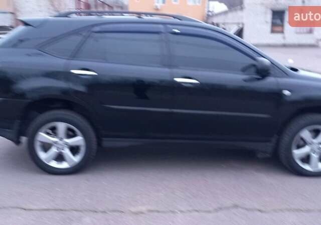 Черный Лексус РХ, объемом двигателя 3.46 л и пробегом 270 тыс. км за 12500 $, фото 1 на Automoto.ua