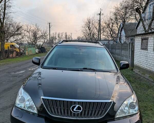 Чорний Лексус РХ, об'ємом двигуна 3.46 л та пробігом 264 тис. км за 11777 $, фото 1 на Automoto.ua