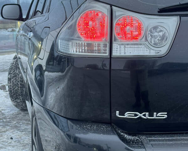 Черный Лексус РХ, объемом двигателя 3.46 л и пробегом 195 тыс. км за 11950 $, фото 198 на Automoto.ua