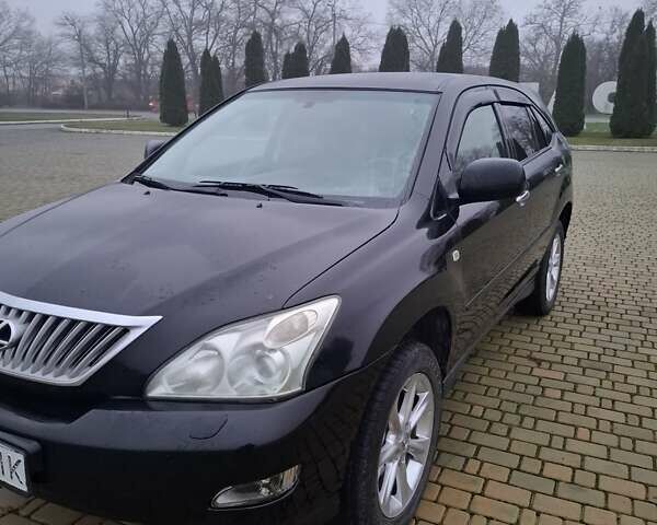 Черный Лексус РХ, объемом двигателя 3.46 л и пробегом 260 тыс. км за 11000 $, фото 1 на Automoto.ua