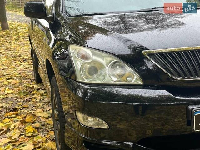 Черный Лексус РХ, объемом двигателя 3.5 л и пробегом 295 тыс. км за 10790 $, фото 1 на Automoto.ua