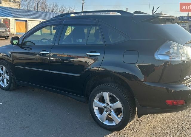 Чорний Лексус РХ, об'ємом двигуна 3.46 л та пробігом 221 тис. км за 10500 $, фото 1 на Automoto.ua