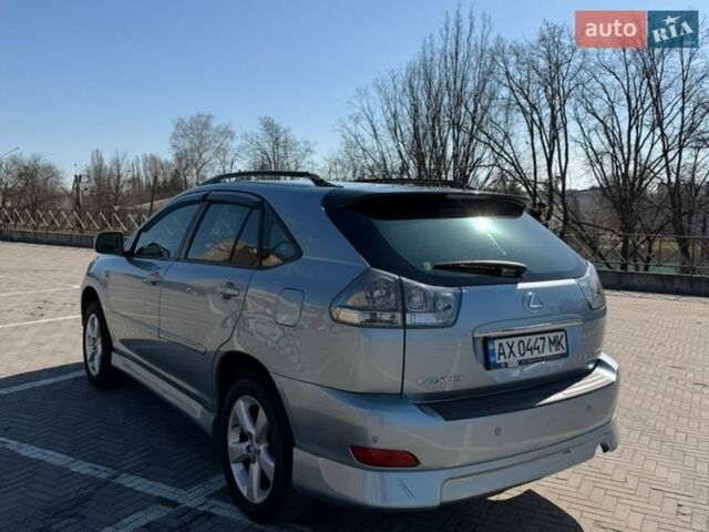 Синий Лексус РХ, объемом двигателя 3.5 л и пробегом 257 тыс. км за 11200 $, фото 4 на Automoto.ua