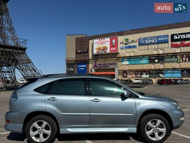 Синий Лексус РХ, объемом двигателя 3.5 л и пробегом 257 тыс. км за 11200 $, фото 1 на Automoto.ua