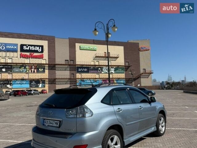 Синий Лексус РХ, объемом двигателя 3.5 л и пробегом 257 тыс. км за 11200 $, фото 2 на Automoto.ua