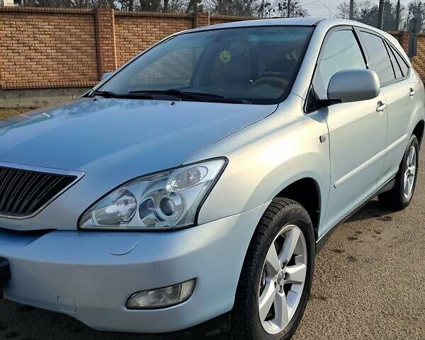 Синий Лексус РХ, объемом двигателя 3 л и пробегом 194 тыс. км за 9800 $, фото 1 на Automoto.ua