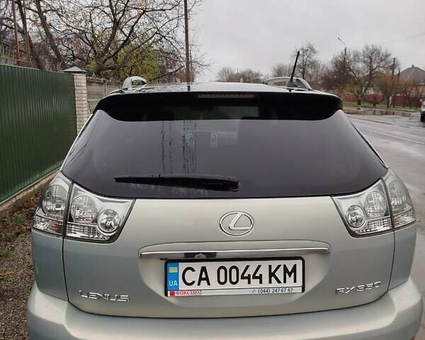 Зеленый Лексус РХ, объемом двигателя 3.5 л и пробегом 298 тыс. км за 10500 $, фото 1 на Automoto.ua