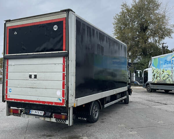 Черный МАН 8.150 груз., объемом двигателя 4.6 л и пробегом 700 тыс. км за 11000 $, фото 2 на Automoto.ua