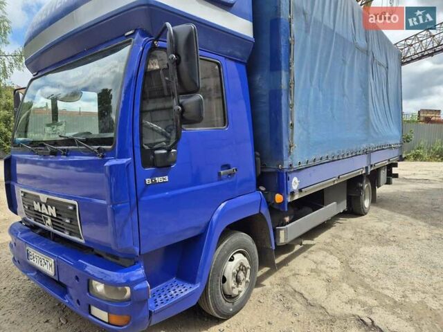 Синий МАН Л 2000, объемом двигателя 4.6 л и пробегом 374 тыс. км за 10500 $, фото 1 на Automoto.ua